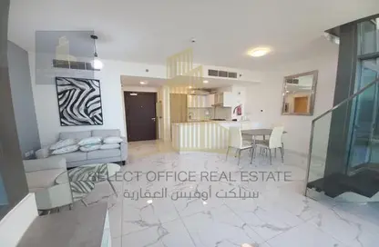 Living / Dining Room image for: Duplex - 2 Bedrooms - 3 Bathrooms for rent in Al Raha Beach Hotel - Al Raha Beach - Abu Dhabi, Image 1