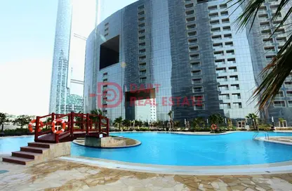 صورة لـ حوض سباحة شقة - غرفة نوم - 2 حمامات للايجار في برج البوابة 3 - شمس أبوظبي - جزيرة الريم - أبوظبي ، صورة رقم 1