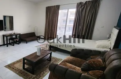 Living Room image for: Apartment - 2 Bathrooms for rent in Kensington Manor - Jumeirah Village Circle - Dubai, Image 1