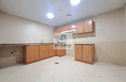Kitchen image for: Apartment - 2 Bedrooms - 2 Bathrooms for rent in Aliya Tower - Al Nahda - Sharjah, Image 1