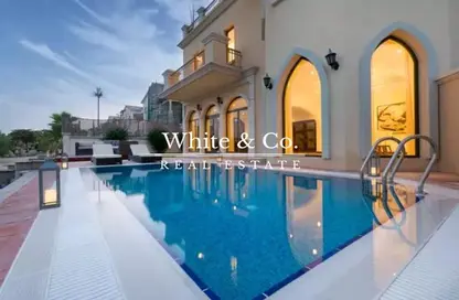 Pool image for: Villa - 6 Bedrooms - 6 Bathrooms for rent in Garden Homes Frond C - Garden Homes - Palm Jumeirah - Dubai, Image 1