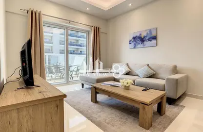 Living Room image for: Apartment - 1 Bedroom - 2 Bathrooms for rent in Hera Tower - Dubai Sports City - Dubai, Image 1