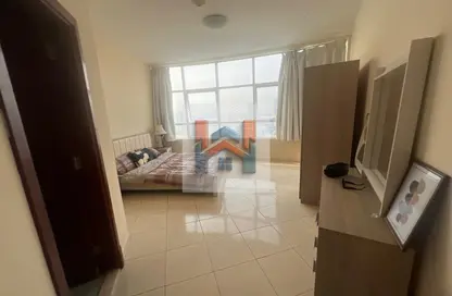 شقة - غرفة نوم - 2 حمامات للايجار في أورينت تاور 1 - أورينت تاور - البستان - عجمان