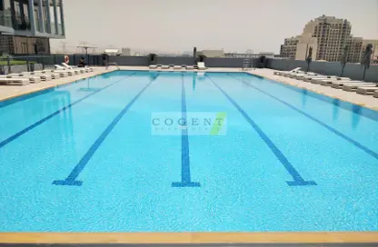 Pool image for: Apartment - 1 Bedroom - 2 Bathrooms for sale in Bloom Towers C - Bloom Towers - Jumeirah Village Circle - Dubai, Image 1