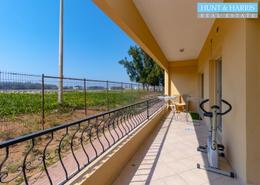 Balcony image for: Apartment - 1 bedroom - 2 bathrooms for rent in Golf Apartments - Al Hamra Village - Ras Al Khaimah, Image 1