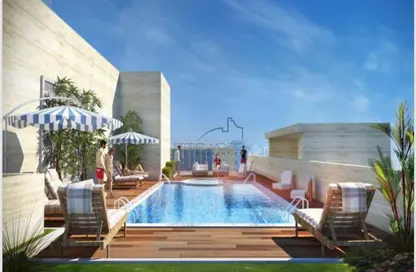 صورة لـ حوض سباحة شقة - 2 غرف نوم - 3 حمامات للبيع في الأمل تاور - مدينة دبي الرياضية - دبي ، صورة رقم 1