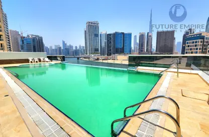 صورة لـ حوض سباحة شقة - غرفة نوم - 2 حمامات للايجار في XV الفن - الخليج التجاري - دبي ، صورة رقم 1