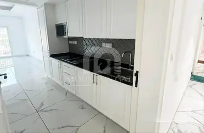 صورة لـ مطبخ شقة - 1 حمام للبيع في الغاف 1 - ارجان - دبي ، صورة رقم 1
