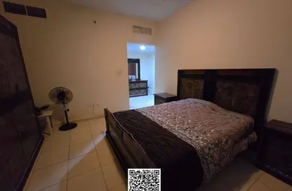 شقة - غرفة نوم - 2 حمامات للايجار في أورينت تاور 1 - أورينت تاور - البستان - عجمان