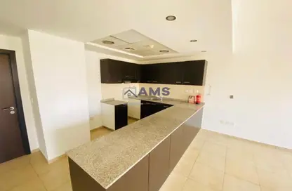 Kitchen image for: Apartment - 2 Bedrooms - 2 Bathrooms for sale in Al Thamam 24 - Al Thamam - Remraam - Dubai, Image 1