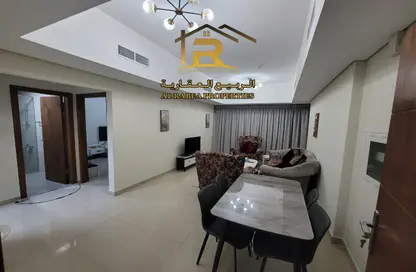 Living / Dining Room image for: Apartment - 1 Bedroom - 2 Bathrooms for rent in Nuaimia One Tower - Al Nuaimiya - Ajman, Image 1