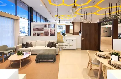 Living / Dining Room image for: Apartment - 1 Bedroom - 2 Bathrooms for sale in Symbolic Alpha - Queue Point - Dubai Land - Dubai, Image 1