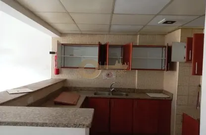 Kitchen image for: Apartment - 1 Bedroom - 2 Bathrooms for rent in IC1-EMR-21 - Emirates Cluster - International City - Dubai, Image 1