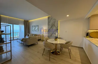 Living / Dining Room image for: Apartment - 2 Bedrooms - 3 Bathrooms for rent in Royal breeze 3 - Royal Breeze - Al Hamra Village - Ras Al Khaimah, Image 1