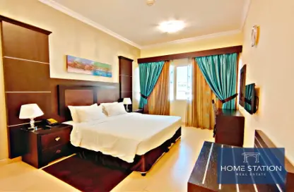 Room / Bedroom image for: Apartment - 1 Bedroom - 2 Bathrooms for rent in Ivory Grand Hotel Apartments - Al Barsha 1 - Al Barsha - Dubai, Image 1