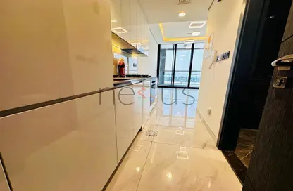 Kitchen image for: Apartment - 1 Bathroom for rent in Samana Golf Avenue - Dubai Studio City - Dubai, Image 1