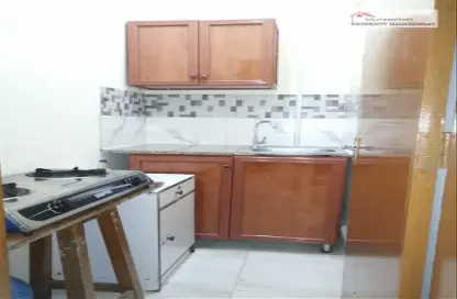 Kitchen image for: Apartment - 1 Bathroom for rent in Al Zahraa - Abu Dhabi, Image 1