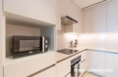 Kitchen image for: Apartment - 1 Bedroom - 2 Bathrooms for rent in Jumeirah Gate Tower 1 - The Address Jumeirah Resort and Spa - Jumeirah Beach Residence - Dubai, Image 1