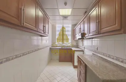 صورة لـ مطبخ شقة - 2 غرف نوم - 2 حمامات للايجار في برج جلوبال - شارع إلكترا - أبوظبي ، صورة رقم 1