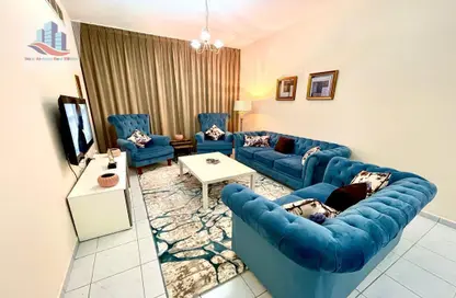 Living Room image for: Apartment - 2 Bedrooms - 2 Bathrooms for rent in Babel Towers - Al Majaz 3 - Al Majaz - Sharjah, Image 1