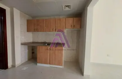 Kitchen image for: Apartment - 1 Bedroom - 2 Bathrooms for rent in L09 Building - Greece Cluster - International City - Dubai, Image 1
