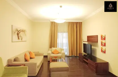 Living Room image for: Apartment - 2 Bedrooms - 2 Bathrooms for rent in Al Nawras Hotel Apartments - Al Nahda 1 - Al Nahda - Dubai, Image 1