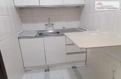 صورة لـ مطبخ شقة - غرفة نوم - 1 حمام للايجار في برج المرور - منطقة المرور - أبوظبي ، صورة رقم 1