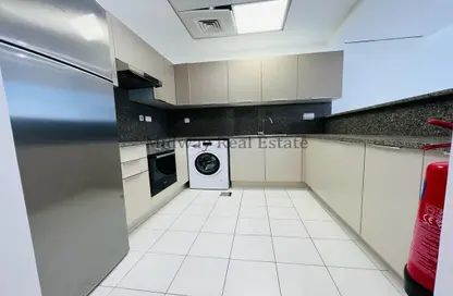 Kitchen image for: Apartment - 1 Bedroom - 2 Bathrooms for rent in C2302 - Khalifa City A - Khalifa City - Abu Dhabi, Image 1