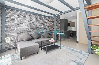 Living Room image for: Apartment - 1 Bathroom for rent in Aria - Jumeirah Village Circle - Dubai, Image 1
