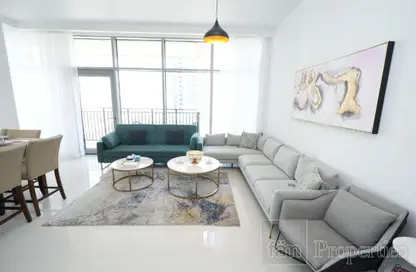 Living Room image for: Apartment - 2 Bedrooms - 3 Bathrooms for rent in Boulevard Crescent 2 - BLVD Crescent - Downtown Dubai - Dubai, Image 1