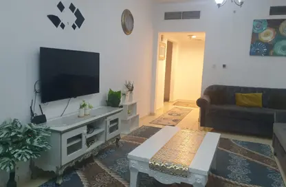 شقة - غرفة نوم - 2 حمامات للايجار في أورينت تاور 1 - أورينت تاور - البستان - عجمان