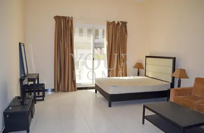 Room / Bedroom image for: Apartment - 1 Bathroom for sale in Knightsbridge Court - Jumeirah Village Circle - Dubai, Image 1