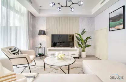 Living Room image for: Townhouse - 3 Bedrooms - 2 Bathrooms for rent in Just Cavalli Villas - Aquilegia - Damac Hills 2 - Dubai, Image 1