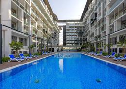 Pool image for: Duplex - 2 bedrooms - 2 bathrooms for sale in Oasis 2 - Oasis Residences - Masdar City - Abu Dhabi, Image 1