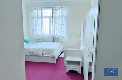 Room / Bedroom image for: Apartment - 1 Bedroom - 2 Bathrooms for sale in Mazaya 2 - Queue Point - Dubai Land - Dubai, Image 1