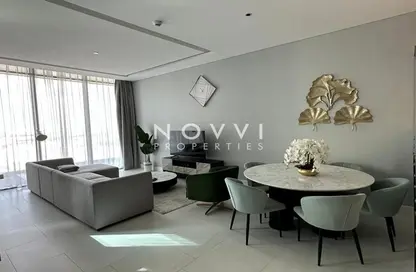 Living / Dining Room image for: Apartment - 2 Bedrooms - 3 Bathrooms for rent in SLS Dubai Hotel  and  Residences - Business Bay - Dubai, Image 1