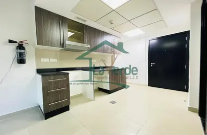 Kitchen image for: Apartment - 1 Bathroom for sale in Tower 40 - Al Reef Downtown - Al Reef - Abu Dhabi, Image 1
