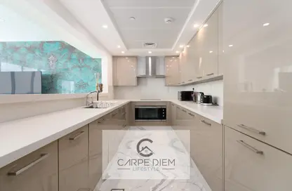 Kitchen image for: Apartment - 3 Bedrooms - 5 Bathrooms for rent in Al Bateen Residences - Jumeirah Beach Residence - Dubai, Image 1