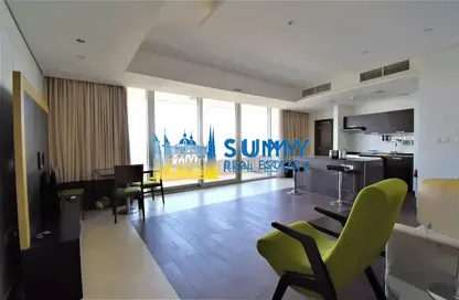 Living / Dining Room image for: Apartment - 1 Bedroom - 2 Bathrooms for rent in The Matrix - Dubai Sports City - Dubai, Image 1