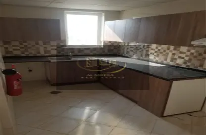Kitchen image for: Apartment - 1 Bathroom for sale in Al Ameera Village - Ajman, Image 1