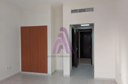 Empty Room image for: Apartment - 1 Bathroom for rent in P21 - France Cluster - International City - Dubai, Image 1