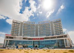 Outdoor Building image for: Shop - 8 bathrooms for rent in Wavez Residence - Liwan - Dubai Land - Dubai, Image 1
