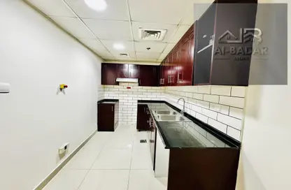 Kitchen image for: Apartment - 2 Bedrooms - 3 Bathrooms for rent in The Manhattan Tower - Jumeirah Village Circle - Dubai, Image 1