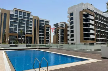 صورة لـ حوض سباحة شقة - 1 حمام للبيع في 34 عزيزي ريفييرا - ميدان واحد - ميدان - دبي ، صورة رقم 1
