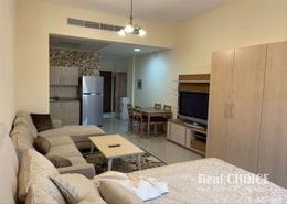 Living Room image for: Studio - 1 bathroom for sale in Madison Residences - Majan - Dubai, Image 1