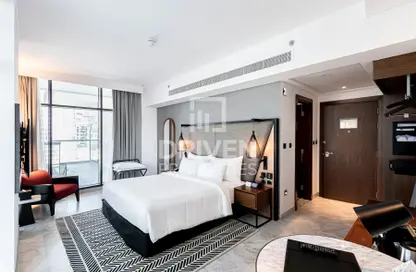 صورة لـ غرفة- غرفة النوم النزل و الشقق الفندقية - 1 حمام للبيع في برج دولفين - الخليج التجاري - دبي ، صورة رقم 1
