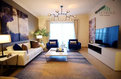 Living Room image for: Apartment - 3 Bedrooms - 4 Bathrooms for sale in Qamar 11 - Madinat Badr - Al Muhaisnah - Dubai, Image 1