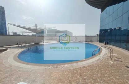 صورة لـ حوض سباحة شقة - 2 غرف نوم - 3 حمامات للايجار في كوبثورن وسط المدينة - الدانه - أبوظبي ، صورة رقم 1