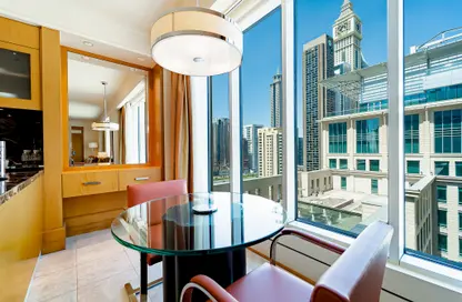 صورة لـ غرفة الطعام النزل و الشقق الفندقية - غرفة نوم - 2 حمامات للايجار في ريتز كارلتون - مركز دبي المالي العالمي - دبي ، صورة رقم 1