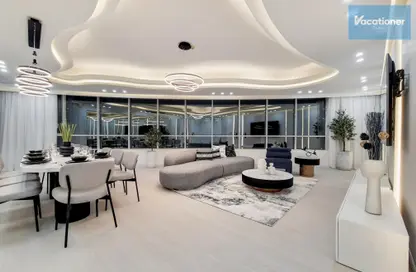 Living / Dining Room image for: Apartment - 4 Bedrooms - 3 Bathrooms for rent in Horizon Tower - Dubai Marina - Dubai, Image 1